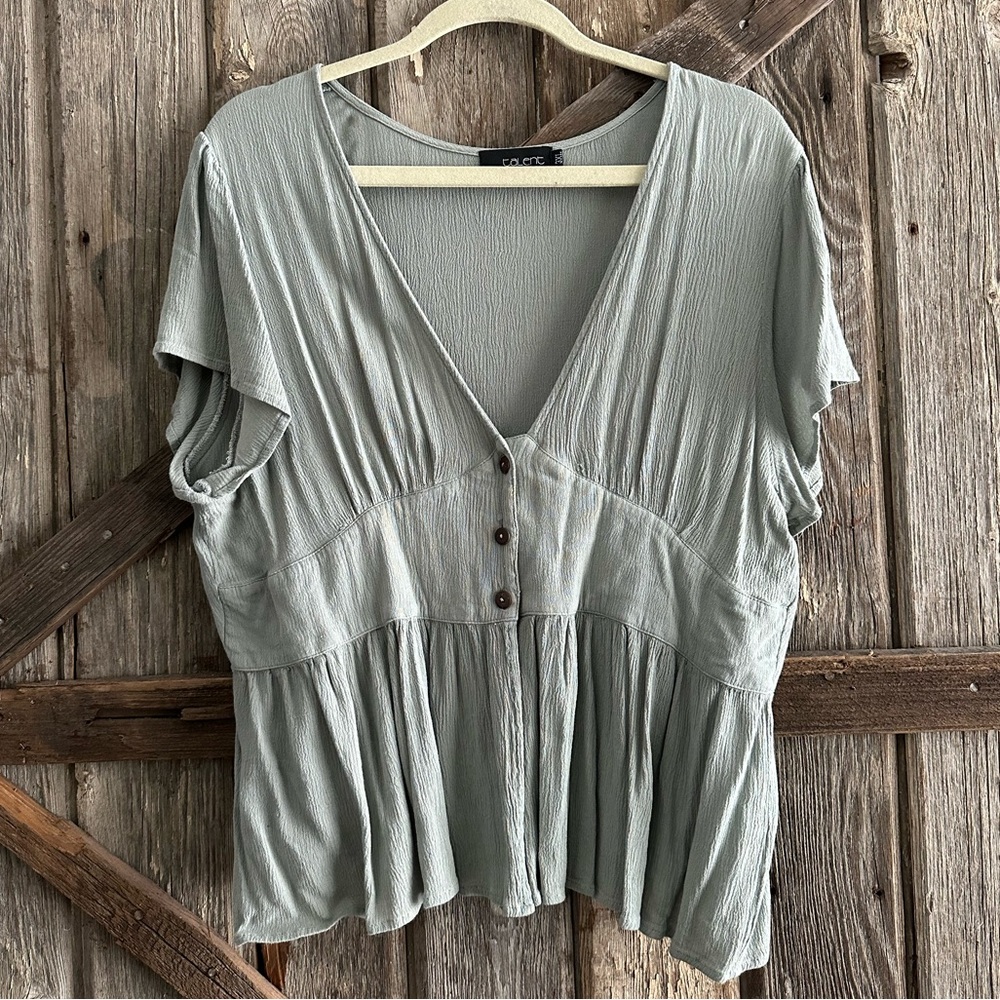 Light peplum button top